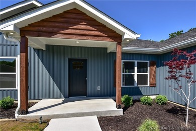 BRAND NEW HOME in the HEART of Osage Beach!! This striking home - photo 4