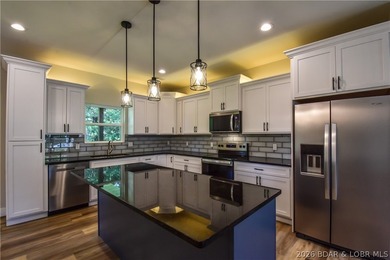 BRAND NEW HOME in the HEART of Osage Beach!! This striking home - photo 5