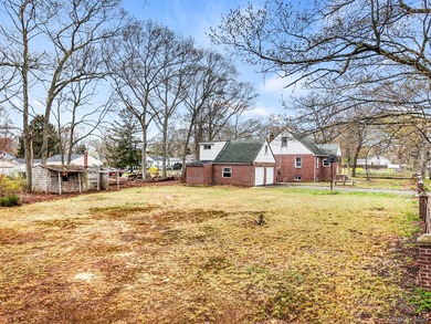 This spacious corner property nestled on a estimated half-acre - photo 5