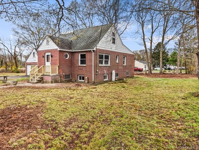 This spacious corner property nestled on a estimated half-acre - photo 8