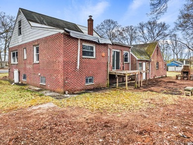 This spacious corner property nestled on a estimated half-acre - photo 9