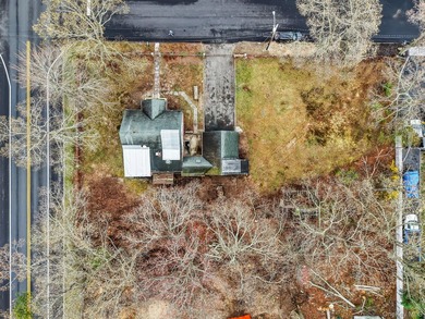 This spacious corner property nestled on a estimated half-acre - photo 10