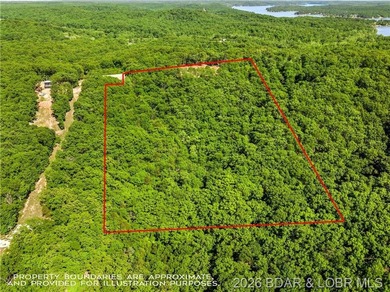 Perched above the Lake of the Ozarks with impressive views and a - photo 7