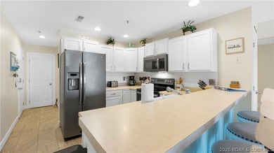 Experience the perfect blend of modern comfort & lakeside living - photo 5