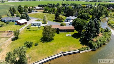 Experience the beauty of riverfront living with this incredible - photo 1