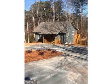 Located on a .46-acre lakefront lot in Martin, GA, 410 Lakeside - photo 13