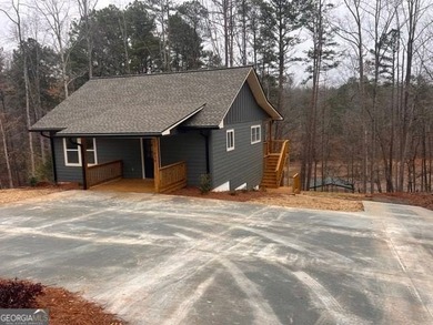 Located on a .46-acre lakefront lot in Martin, GA, 410 Lakeside - photo 14