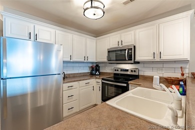 Enjoy large lake views and effortless access at this beautifully - photo 9