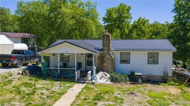 Tucked near the water in Warsaw, this 3-bedroom, 1-bath ranch - photo 2