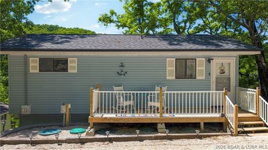 Tucked along a quiet cove at the 3 MM, 131 Walnut Drive is the - photo 1