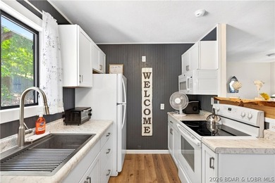 Tucked along a quiet cove at the 3 MM, 131 Walnut Drive is the - photo 3