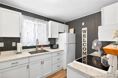 Tucked along a quiet cove at the 3 MM, 131 Walnut Drive is the - photo 4