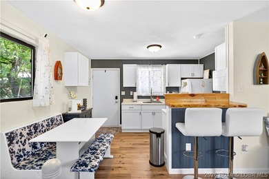 Tucked along a quiet cove at the 3 MM, 131 Walnut Drive is the - photo 8