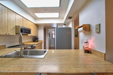 Lovely second floor condo tucked along the edge of lush - photo 13