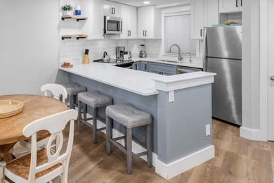 This beautifully appointed 2-bedroom, 2-bath condo is move-in or - photo 9