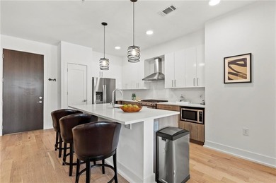 Better than new, this top-floor Midtown residence impresses with