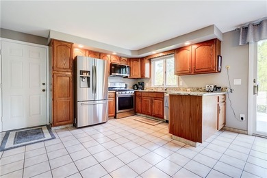 Welcome to this well-maintained split level home in Gates. Lots - photo 7