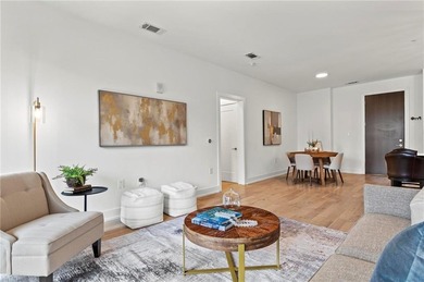 Better than new, this top-floor Midtown residence impresses with