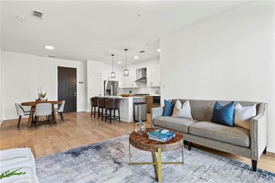 Better than new, this top-floor Midtown residence impresses with