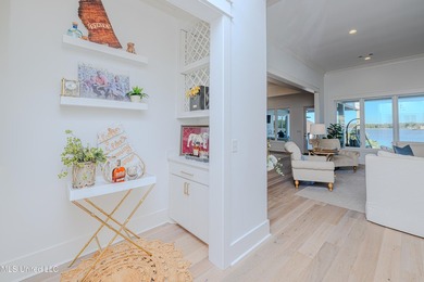 Poised along the water's edge in the prestigious Reunion Golf