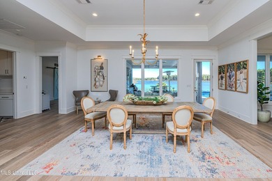 Poised along the water's edge in the prestigious Reunion Golf