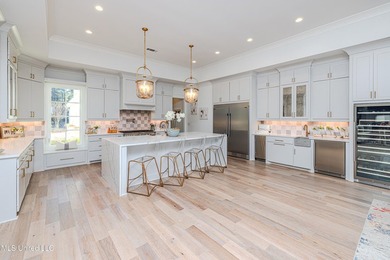 Poised along the water's edge in the prestigious Reunion Golf