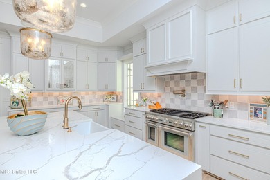 Poised along the water's edge in the prestigious Reunion Golf