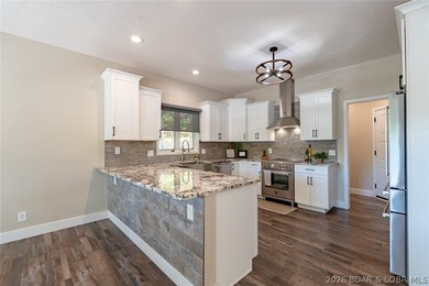 Newly updated lakefront home in Four Seasons with Brand New Roof - photo 14