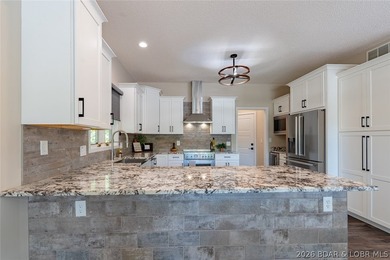 Newly updated lakefront home in Four Seasons with Brand New Roof - photo 15