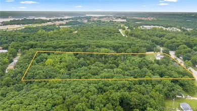 7.8 +/- wooded acres in the heart of Osage Beach with city sewer - photo 2