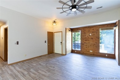 Welcome to this 3-bedroom, 2-bathroom home in Sunrise Beach, MO - photo 1