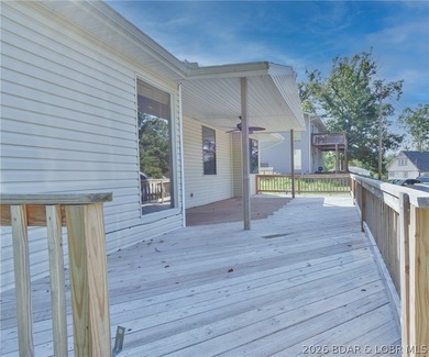 Welcome to this 3-bedroom, 2-bathroom home in Sunrise Beach, MO - photo 4