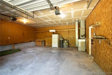 Welcome to this 3-bedroom, 2-bathroom home in Sunrise Beach, MO - photo 5