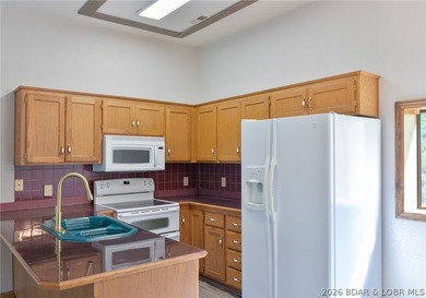 Welcome to this 3-bedroom, 2-bathroom home in Sunrise Beach, MO - photo 8