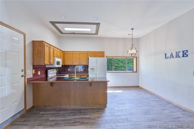 Welcome to this 3-bedroom, 2-bathroom home in Sunrise Beach, MO - photo 9