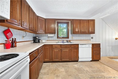 Tucked away on 2.33 lakefront acres, 33400 Kings Way Road offers - photo 3