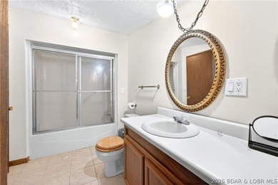 Tucked away on 2.33 lakefront acres, 33400 Kings Way Road offers - photo 8