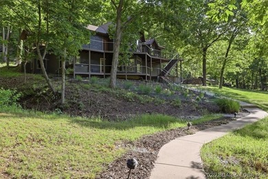 Tucked into the trees on over 8 acres at the 47MM in cove, this - photo 1