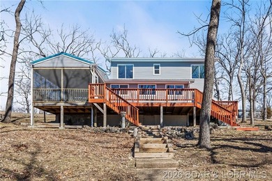 Newer metal roof, gutters & downspouts, newer vinyl siding - photo 1
