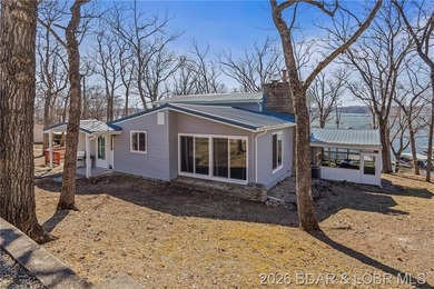 Newer metal roof, gutters & downspouts, newer vinyl siding - photo 4