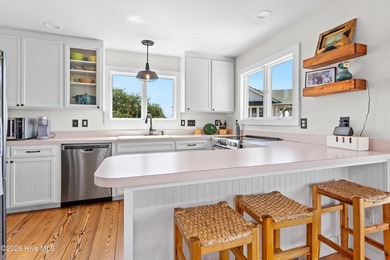 Set on one of Wrightsville Beach's most coveted streets in the - photo 9