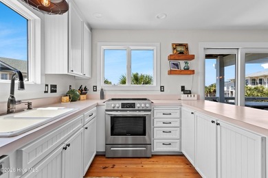 Set on one of Wrightsville Beach's most coveted streets in the - photo 10