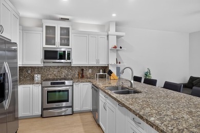 Welcome to this stunning waterfront residence nestled in The - photo 11