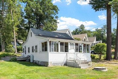Tucked into a charming lake community, this property at 32 Ells - photo 2