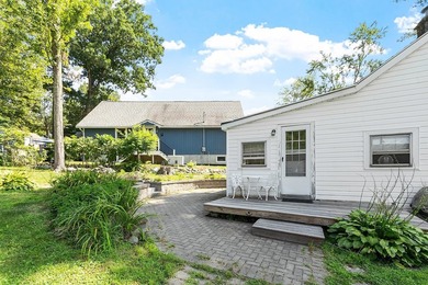 Tucked into a charming lake community, this property at 32 Ells - photo 9
