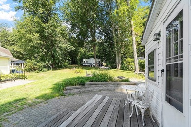 Tucked into a charming lake community, this property at 32 Ells - photo 10