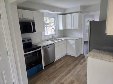 PRICE REDUCED & FRESH LANDSCAPING JUST COMPLETED! The heavy - photo 2