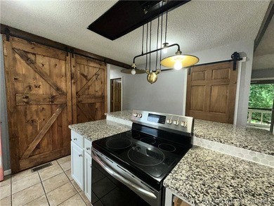 4-bed, 2-bath home in Warsaw featuring an open floor plan - photo 7