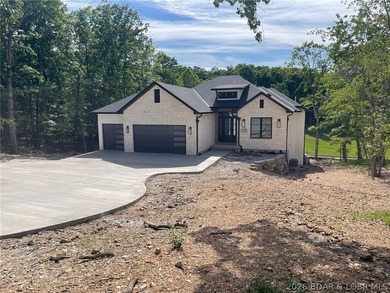 WOW Setting! New Construction! Sitting on over 1/2 an acre, this - photo 1