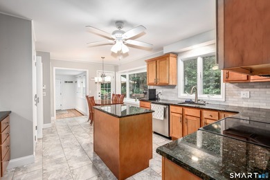 Nestled on a private, beautifully landscaped lot in the highly - photo 2